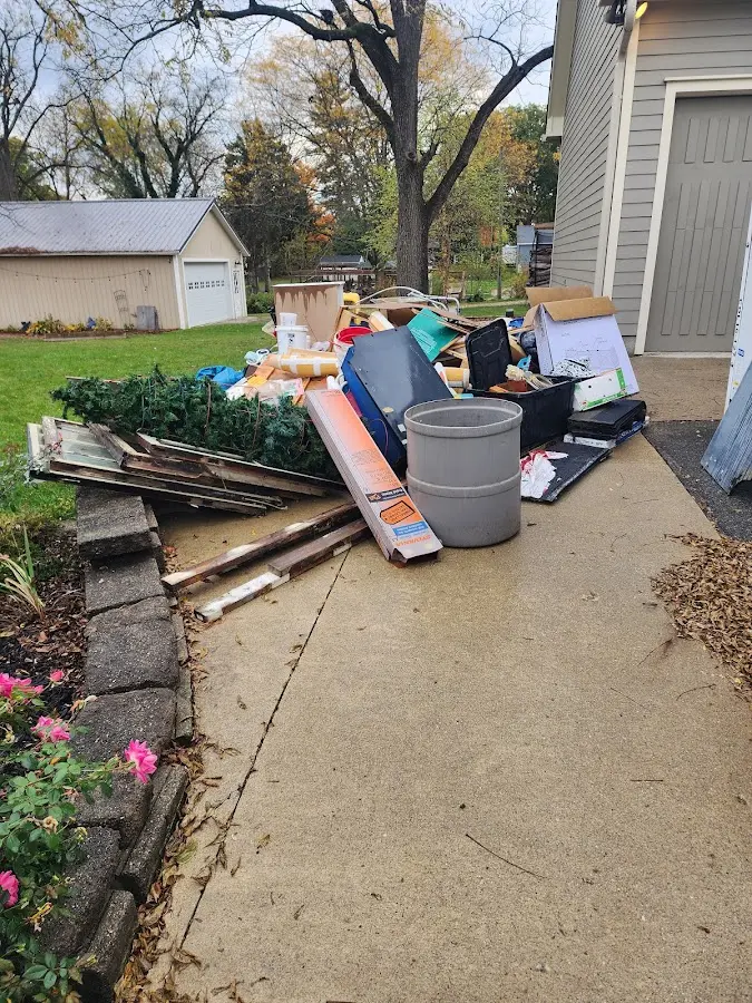 Dumpster being loaded with debris for Residential Dumpster Rental in Town and Country